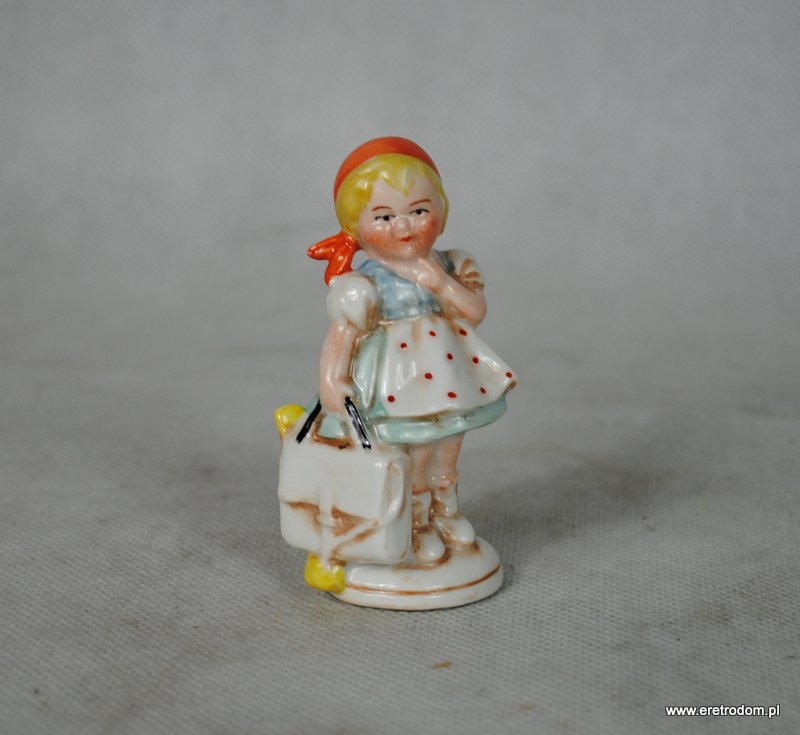 porcelanowa figurka dziewczynka z torebką